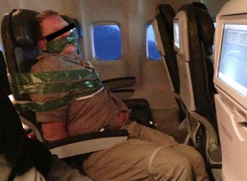 Drunk passenger restrained